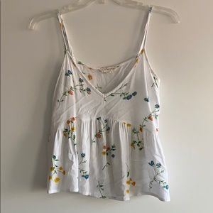 White top with flower detail